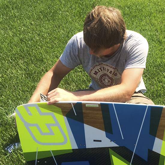 George I. Pare' of True Progression Kiteboarding assembling a 2014 Crazyfly Cruizer Pro board for a client.  Razor fins